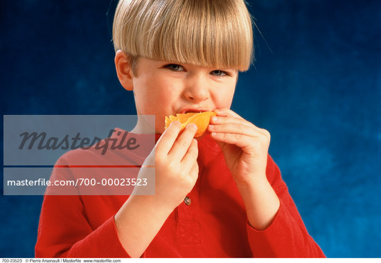 Boy Eating Orange