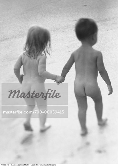 Back View of Nude Children Walking on Beach Holding Hands