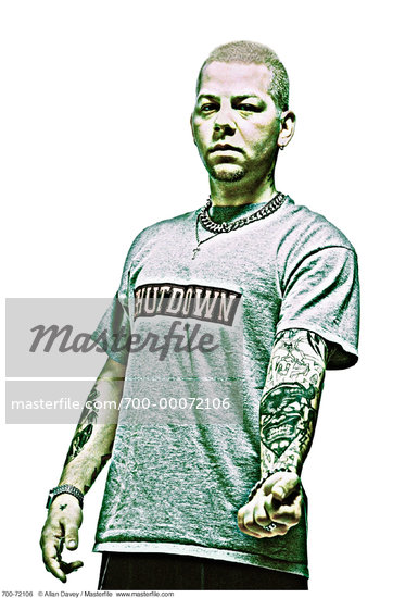 Portrait of Man Showing Tattoos On Forearm Stock Photo RightsManaged 