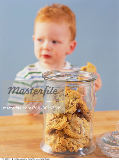 child eating cookies