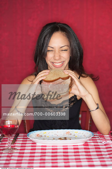 woman holding sandwich