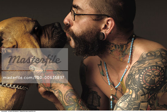 Tattooed Man Kissing Dog Stock Photo RightsManaged Artist David 