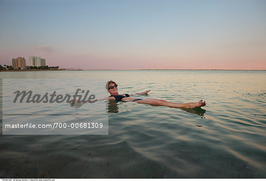 adult swimming ocean Dead Sea