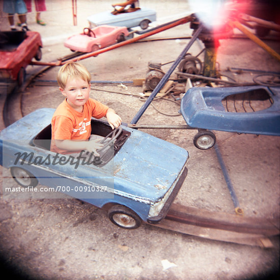 Boy Riding Toy Car At Playground Cuba Stock Photo RightsManaged Artist