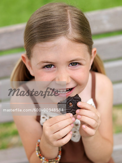 child eating cookies