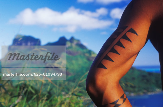 Tattoo on a man's arm Hawaii USA Stock Photo RoyaltyFreenull