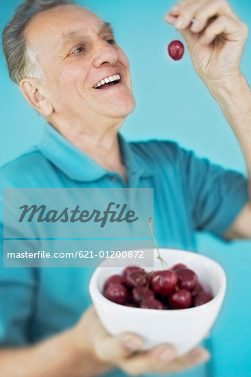 Man Eating Cherries