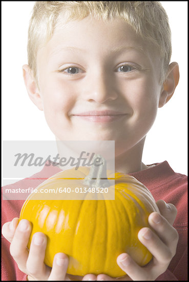 Holding A Pumpkin