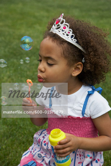 Girl Blowing Bubbles Stock Photo RoyaltyFree Artist Masterfile Code