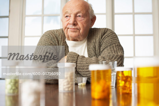 man taking pills