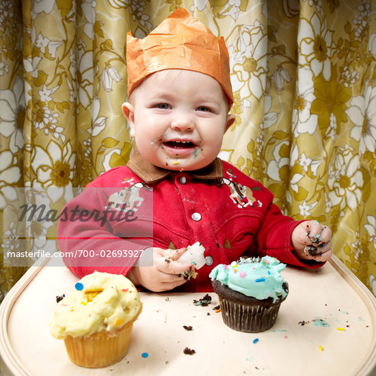 baby eating cupcake