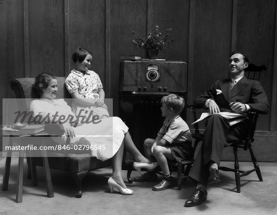 1930s family man father woman mother girl daughter boy son in living room