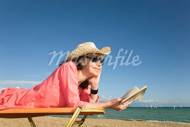 Woman On Sunlounger