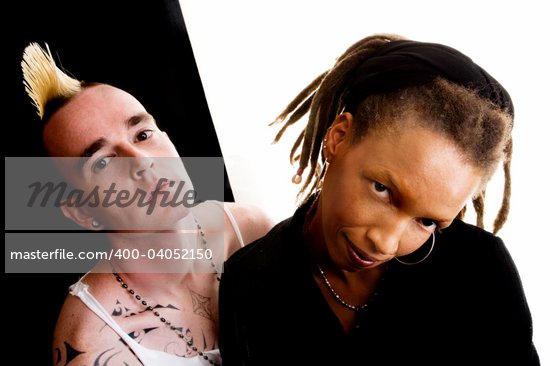 Portrait of white man with mohawk and black woman with dreadlocks