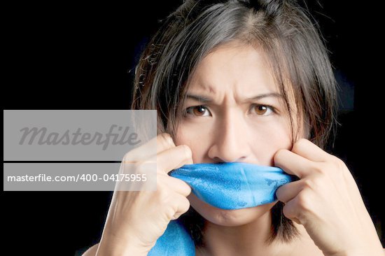 Girl gagged with blue scarf pulls to free her voice