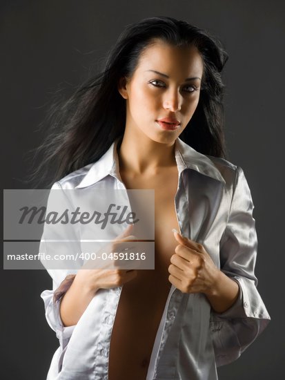 cute portrait of latina girl with long black hair and a sexy shirt