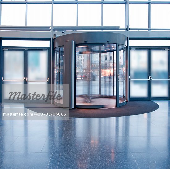 Revolving door in reception of office building Stock Photo - Crestock Royalty-Free, Artist: PinkBadger                    , Code: 400-05706066