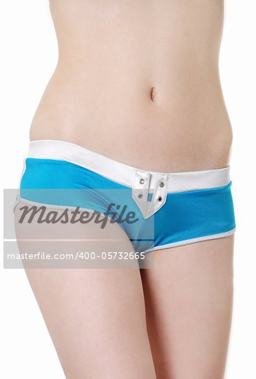 Front view of a fit and young girl dressed in blue underwear isolated on a 