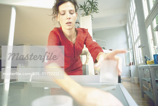 Person Cleaning Table