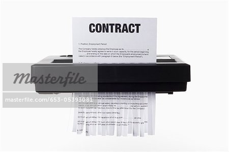 653-05393081em-An-employment-contract-being-shredded-in-a-paper-shredder.jpg