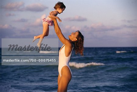  - 700-00075455em-Mother-and-Daughter-in-Swimwear-On-Beach---