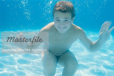  - 700-00091320em-Boy-in-Swimming-Pool---