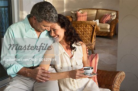  - 700-00527899em-Romantic-Couple-Relaxing-with-Coffee---