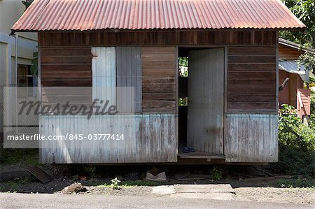  - 845-03777414em-Janet-house--remaining-temporary-home-with-corrugated-roof--supplied-a