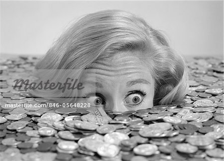 846-05648228em-1960s-BUG-EYED-SURPRISED-WOMAN-BURIED-IN-COINS-MONEY-SYMBOLIC.jpg