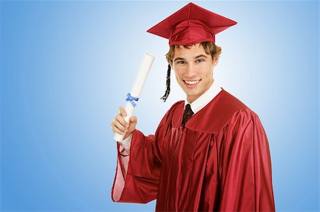 simsearch:400-04505681,k - Handsome young graduate holding his diploma on a blue background with room for text. Stock Photo - Budget Royalty-Free & Subscription, Code: 400-04008170