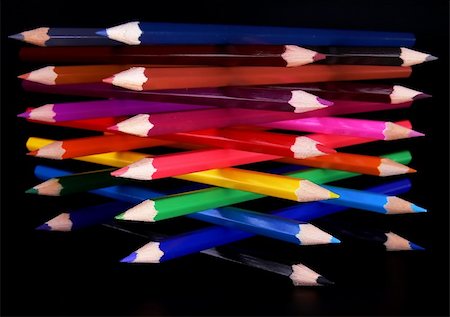 simsearch:400-04046903,k - Top view of colorful pencils tower isolated over black background Stock Photo - Budget Royalty-Free & Subscription, Code: 400-04009230