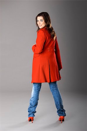 simsearch:400-04130120,k - Beautiful fashion woman posing with a red coat Stock Photo - Budget Royalty-Free & Subscription, Code: 400-04009388