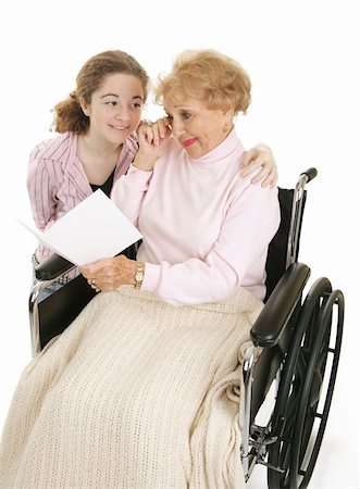 Senior woman crying as she reads a card from her granddaughter.  Isolated on white. Stock Photo - Budget Royalty-Free & Subscription, Code: 400-04009643