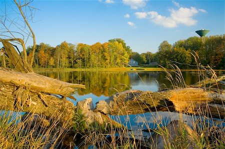 simsearch:400-04909150,k - Autumn over river. Beautiful landscape with trees and water tower and multiple colored leaves. Stock Photo - Budget Royalty-Free & Subscription, Code: 400-04009731