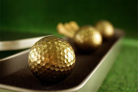 peg - Golden golfballs in gift set for luxury play Stock Photo - Budget Royalty-Free & Subscription, Code: 400-04000094
