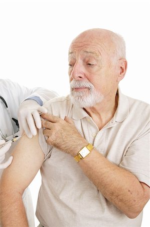 patient thanking doctor - Senior man getting a shot.  Could be medicine or vaccine.  White background. Stock Photo - Budget Royalty-Free & Subscription, Code: 400-04000473