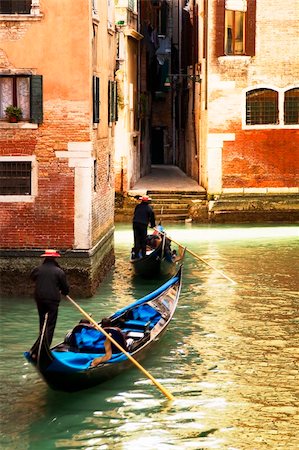 simsearch:400-08093706,k - tourist attractions: Venice at the sunset. The focus is on the left wall while Gondolas are slightly blurred Stock Photo - Budget Royalty-Free & Subscription, Code: 400-04001065