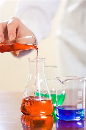 simsearch:400-09011632,k - Analysing process in laboratory: woman's hand turning reagent into Erlenmeyer flask Stock Photo - Budget Royalty-Free & Subscription, Code: 400-04001145