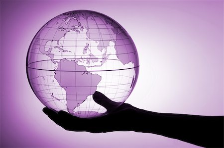 A hand holding translucent globe Stock Photo - Budget Royalty-Free & Subscription, Code: 400-04001386