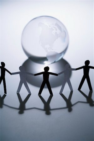 simsearch:700-01195953,k - Black and white cutout paper people standing aroung Earth globe holding hands. Stock Photo - Budget Royalty-Free & Subscription, Code: 400-04002775