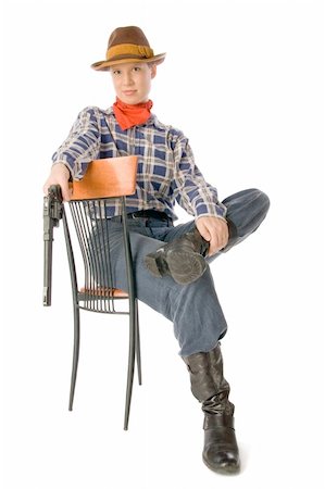 Young woman wearing cowboy clothes holding a gun Foto de stock - Super Valor sin royalties y Suscripción, Código: 400-04014570