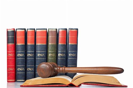 simsearch:700-00028739,k - Wooden gavel from the court over the opened law book reflected on white background with space for text. Shallow DOF Stock Photo - Budget Royalty-Free & Subscription, Code: 400-04015230