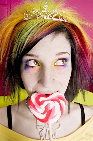 simsearch:400-04016564,k - Alternative Girl in a Colorful Kitchen with a Heart Lollipop Stock Photo - Budget Royalty-Free & Subscription, Code: 400-04015678
