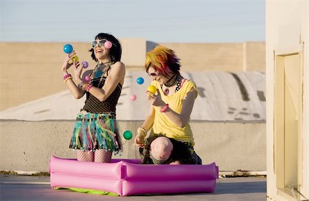 simsearch:400-04016564,k - Punk Girls Juggling Plastic Balls on a Rooftop Stock Photo - Budget Royalty-Free & Subscription, Code: 400-04015680