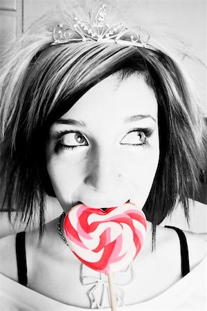 simsearch:400-04016564,k - Black and White Alternative Girl in a Kitchen with a Red and White Heart Lollipop Stock Photo - Budget Royalty-Free & Subscription, Code: 400-04015914