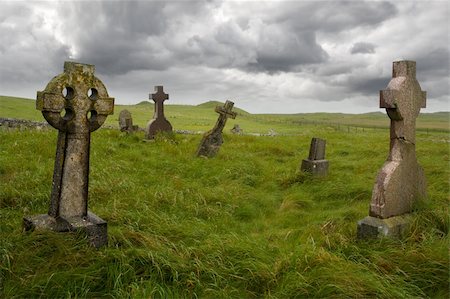 dark eerie sky - Ancient Celtic gravesite with unmarked gravestones from the 1600's in the middle of a meadow in rural Scotland. Stock Photo - Budget Royalty-Free & Subscription, Code: 400-04017179