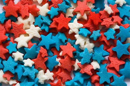 dreaming about eating - Confectionery ornament in the form of blue, red and white stars close up Stock Photo - Budget Royalty-Free & Subscription, Code: 400-04019014