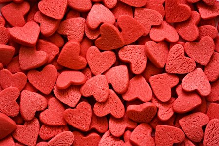 dreaming about eating - Confectionery ornaments in the form of red hearts close up Stock Photo - Budget Royalty-Free & Subscription, Code: 400-04019015