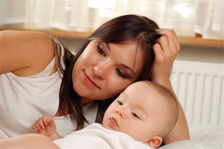 daughter kissing mother - happy family Stock Photo - Budget Royalty-Free & Subscription, Code: 400-04012365