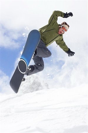 simsearch:400-03985663,k - snowboarder taking jump in fresh powder snow Stock Photo - Budget Royalty-Free & Subscription, Code: 400-04012375